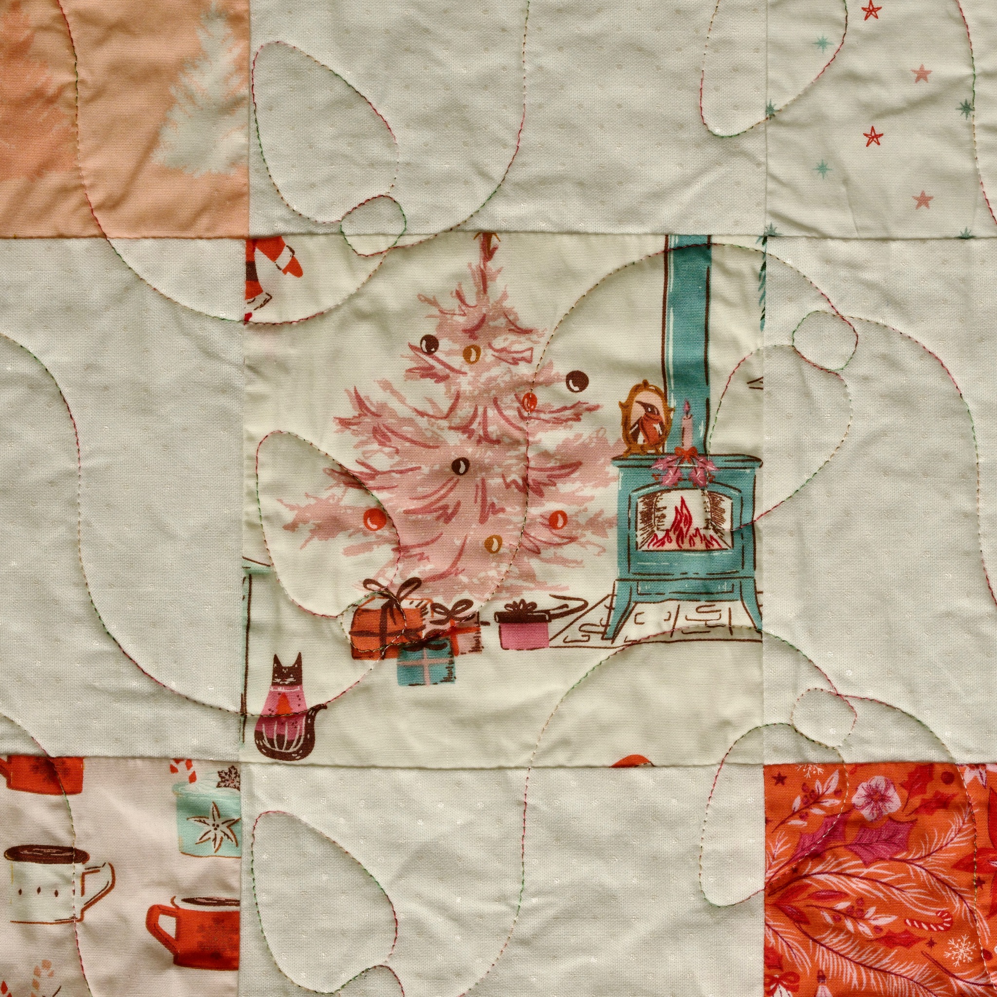 Vintage-style Christmas tree and wood stove novelty print, pieced with orange and cream squares