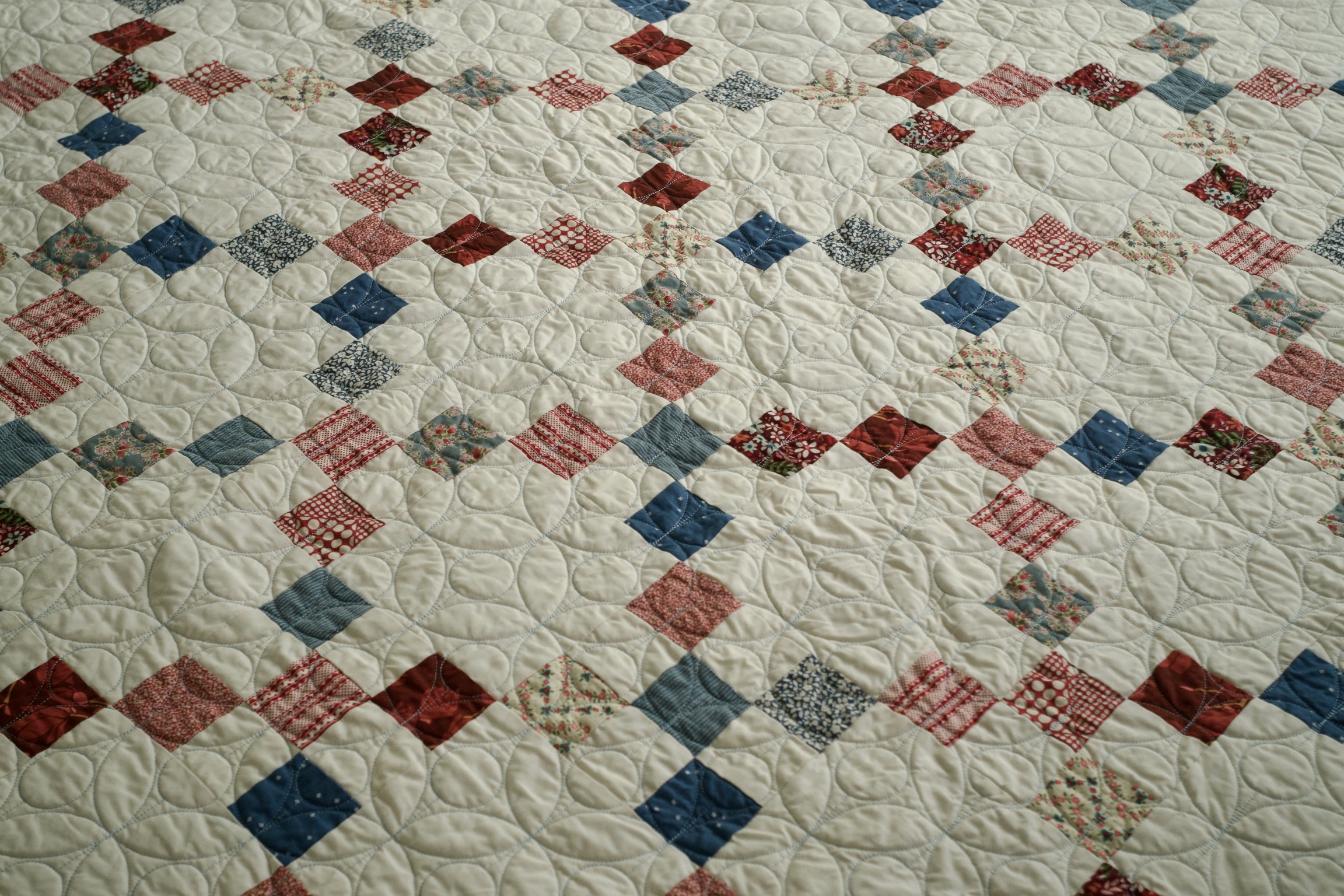 Red, white, and blue patchwork squares set on point