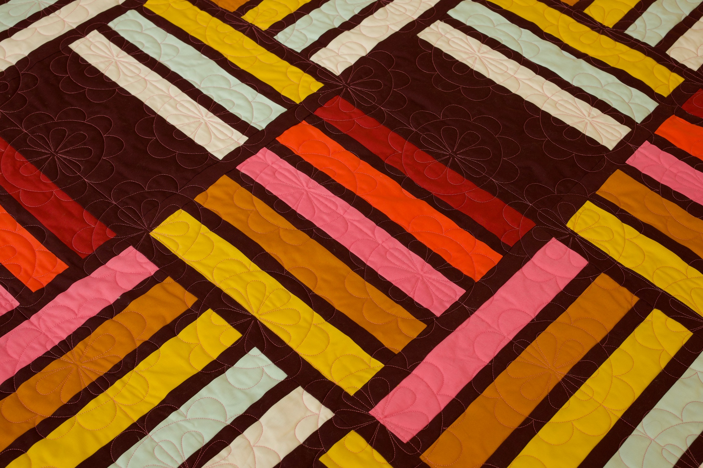Detail of mustard, coral, and mint rectangle patchwork blocks